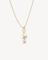 Josephine 18k gold designer pearl pendant with two white freshwater pearls and an oval gold bail.