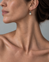 ORFÉLIE Solène designer pearl drop earrings in 18k yellow gold with London Blue Topaz and freshwater pearls, shown on a model