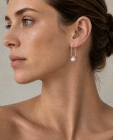 Model wearing ORFÉLIE Emilie designer pearl hoop earrings in sterling silver